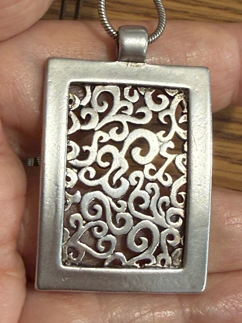 16”-19” Silver Scroll Pendant on a Snake Chain.